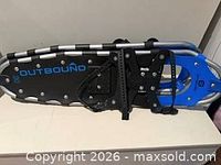 Full view of one snowshoe showing brand logo and binding