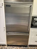 Front view of Viking stainless refrigerator-freezer closed