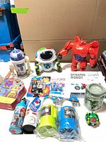 Group shot of all items showing robots, bottles, puzzle, Bionicle and Dynamo Robot box