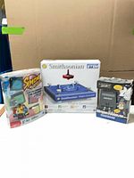 All three boxed games side by side