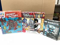 Front view of all three boxed toys