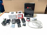 Overview of phones, boxes, charger, batteries, memory cards and mouse