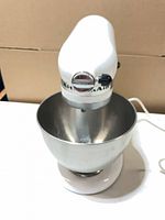 White KitchenAid Classic stand mixer with stainless bowl attached