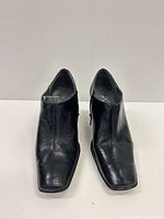 Top front view showing leather, square toes, overall condition