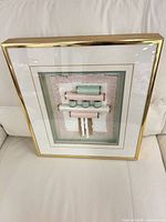 framed artwork front view on sofa