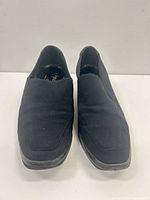 Front view of both shoes showing square toe and fabric uppers