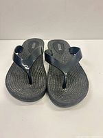 Top view of both flip flops showing straps and rope-textured footbeds