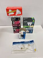 Group shot showing all boxed bulbs and lamp parts