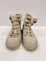 Front view of both boots showing uppers, lacing, and toe condition