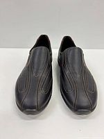 Front view of both loafers showing leather uppers and stitching