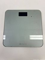 Top view of Etekcity digital scale showing glass surface and LCD window