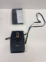 Two phone bags, one displayed, one sealed