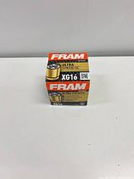 Boxed FRAM XG16 Ultra Synthetic oil filter on white surface