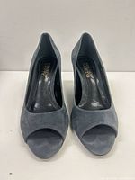 Front view of both gray suede peep toe pumps