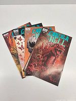 Four Godzilla in Hell comic books fanned out