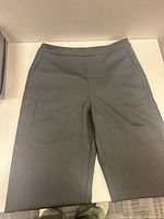 Full view of gray dress pants front side