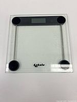Front view of Kabalo tempered glass bathroom scale with LCD display