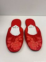 Top view of pair showing embroidery and brand on insole