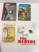 Front covers of all four books laid out
