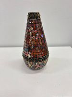 Front view showing full vase and mosaic surface
