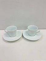 Front view showing both cups on saucers