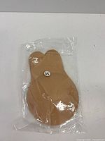 Front view of sealed package showing pair of nipple covers