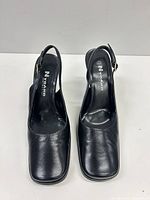 Top view of both shoes showing leather uppers, square toes, Nygard branding on insoles