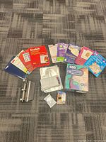 Full lot overview showing all packs, envelopes, ink cartridge and metal punch