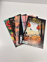 Front covers of all five Over the Garden Wall issues fanned out