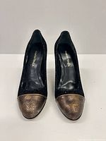 Front view of pair showing cap toe and overall condition