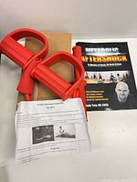 Exerciser components, instruction sheet, workout book