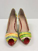 Top view of multicolor striped peep-toe pumps