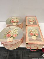 Top view of two round and two rectangular floral boxes