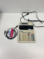 Calculator front with accessories laid out