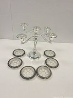 Front view of candelabra with six coasters arranged