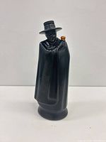 Front view of black ceramic Don decanter