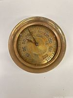 Front view of brass Westinghouse gauge dial 0-200 psi