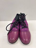 Front view of both ankle boots showing color, laces, and toe condition