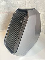 Front angled view showing slim optical drive, Alienware logo, front ports
