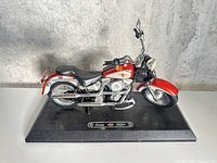 Full view of Barbie Harley-Davidson Fat Boy motorcycle on stand