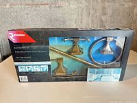 Front view of sealed Richelieu 4-piece bathroom set box showing all included fixtures
