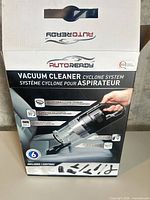 Front of box showing brand, model and image of vacuum