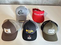 Overview of all five hats on table