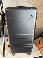 Front view of black Monos suitcase