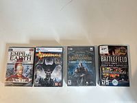 All four sealed PC games side by side