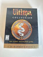 Front of sealed Ultima Collection PC game box showing title, serpent emblem, ESRB M rating