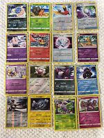 Full view of 16 Pokémon reverse holo cards laid out in 4×4 grid