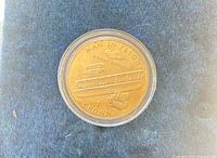 Reverse side with Wright Brothers biplane and inscription MAN IN FLIGHT 1903