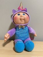 Front view of Cabbage Patch Kids unicorn baby plush doll