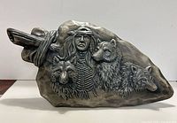 Front view showing entire ceramic relief plaque with Indigenous American and three wolves